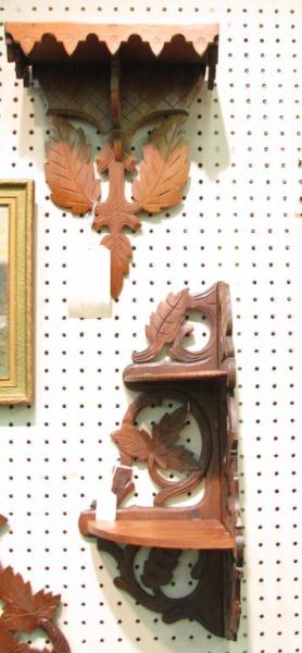 Appraisal: Two carved walnut Victorian wall racks including miniature folding etagere