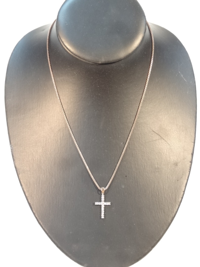 Appraisal: A cross pendant set with sixteen stones claw set cm