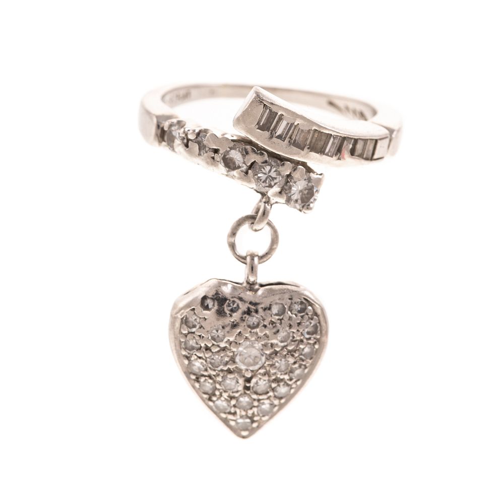 Appraisal: A Diamond Heart Bypass Ring in Platinum Platinum ring features