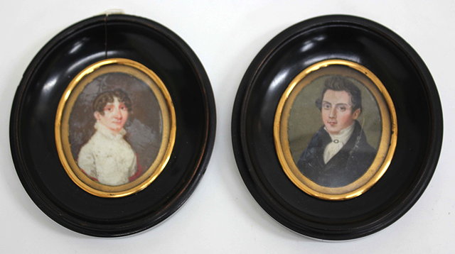 Appraisal: TWO ANTIQUE MINIATURE OVAL PORTRAITS painted on ivory a young