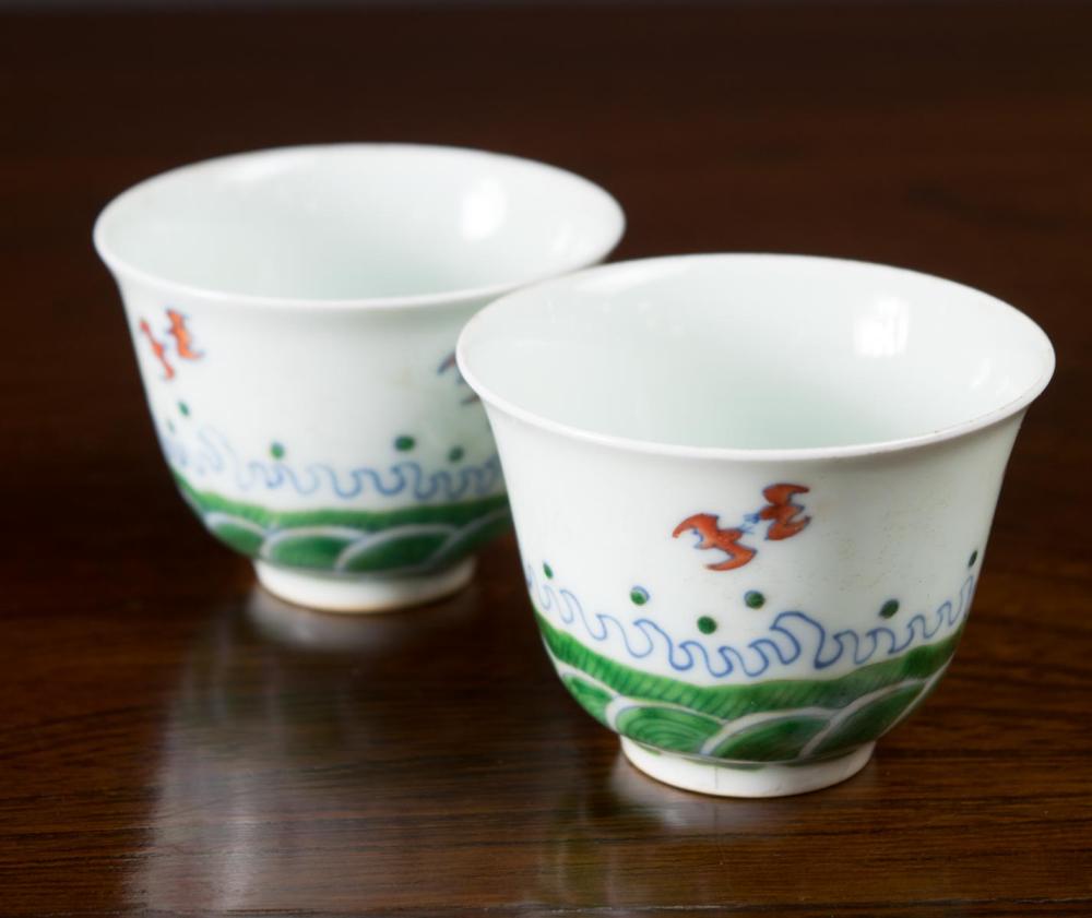 Appraisal: PAIR OF CHINESE DOUCAI PORCELAIN CUPS with hand painted motif