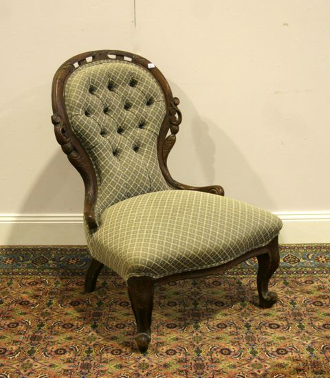 Appraisal: A Victorian walnut and upholstered Grandmother chair