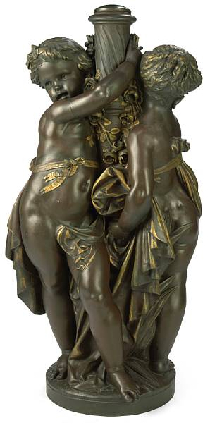 Appraisal: A large French parcel gilt and patinated bronze figural group