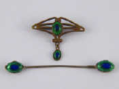 Appraisal: A metal and glass Arts and Crafts brooch x cm