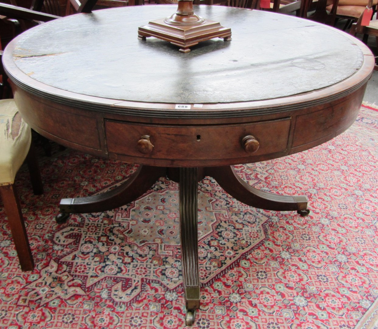 Appraisal: An th century mahogany drum table the leather inset top