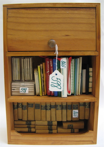 Appraisal: MINIATURE WOOD BOOKCASE FULL OF MINIATURE BOOKS including suede bound