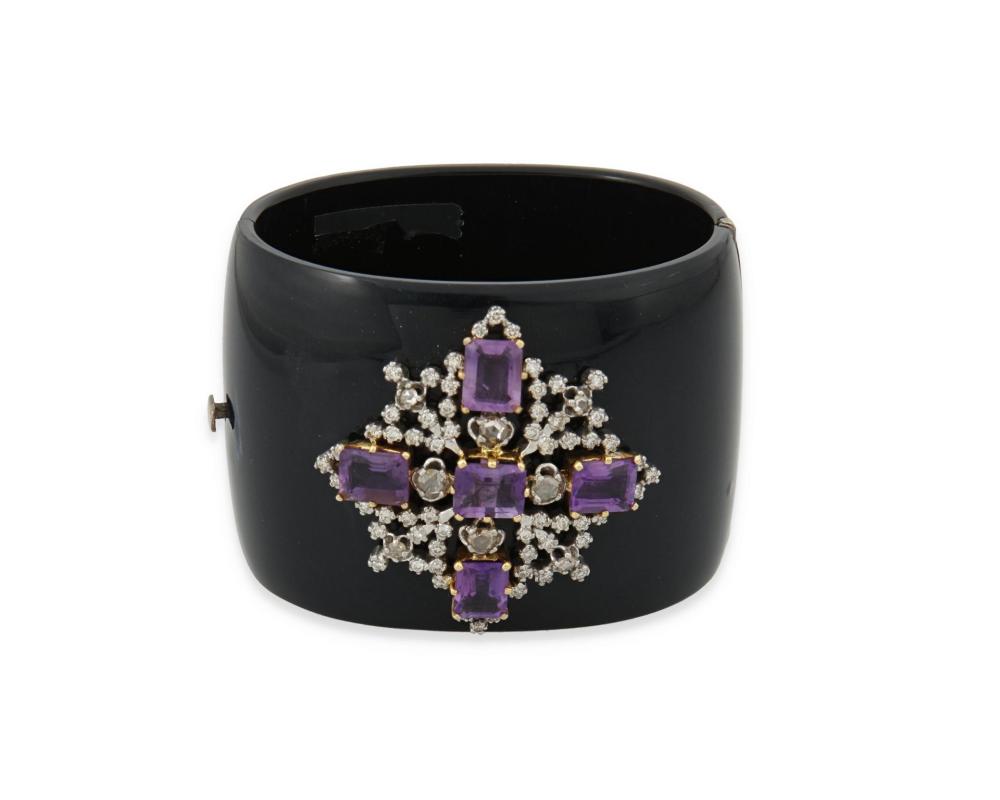 Appraisal: AN AMETHYST DIAMOND AND BLACK ACRYLIC HINGED BANGLE BRACELETAn amethyst