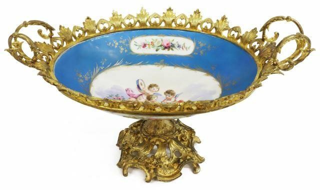 Appraisal: Sevres style porcelain centerpiece in gilt metal mount scrolled foliate