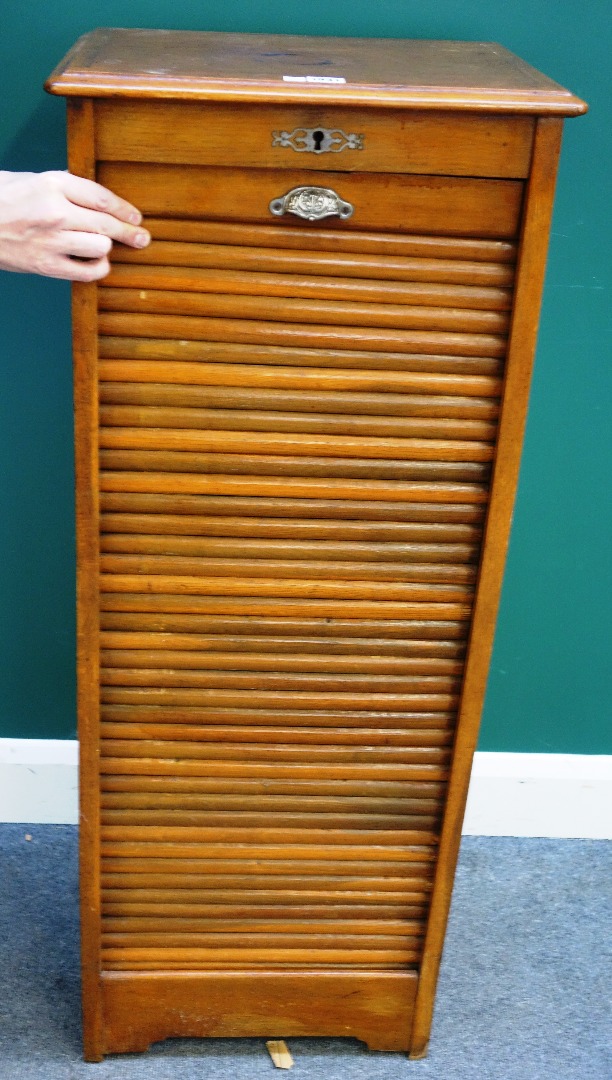 Appraisal: A mid- th century oak filing cabinet with drop tambour