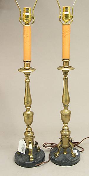 Appraisal: A pair of Baroque style brass candlesticks Each urn and