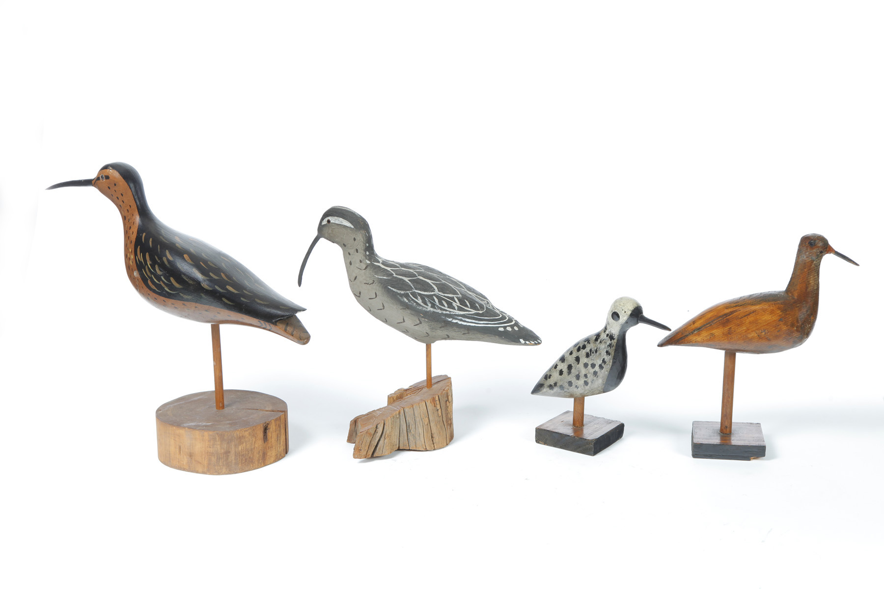 Appraisal: FOUR SHOREBIRD CARVINGS American th century Three with original paint