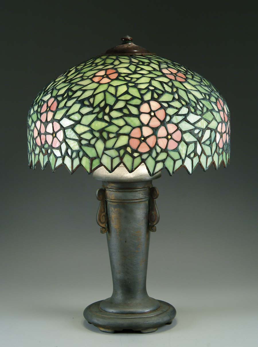 Appraisal: LEADED GLASS TABLE LAMP Lamp shade has pink five petal