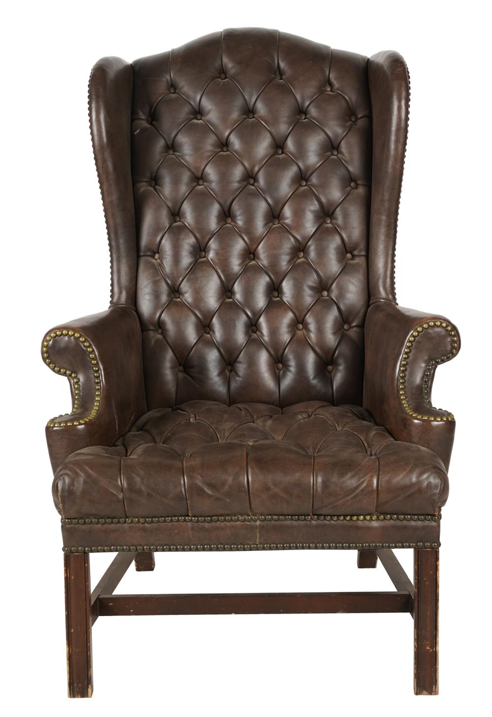 Appraisal: GEORGIAN-STYLE LEATHER WINGCHAIRCondition with wear to wood inches wide inches