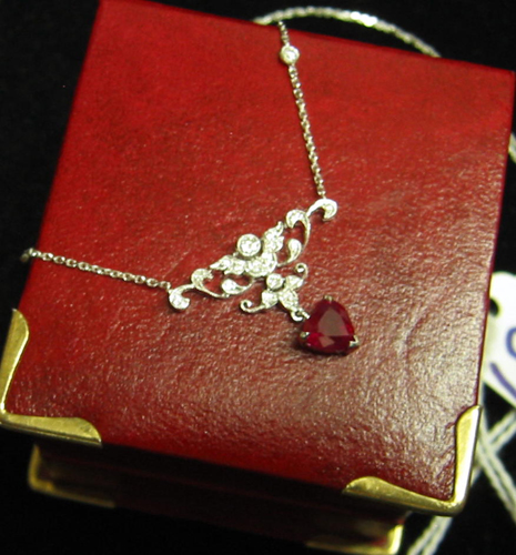 Appraisal: RUBY DIAMOND AND EIGHTEEN KARAT WHITE GOLD PENDANT NECKLACE The