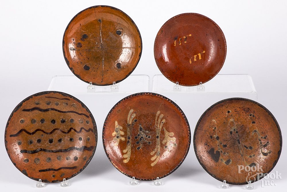 Appraisal: Five redware plates th c Five redware plates th c