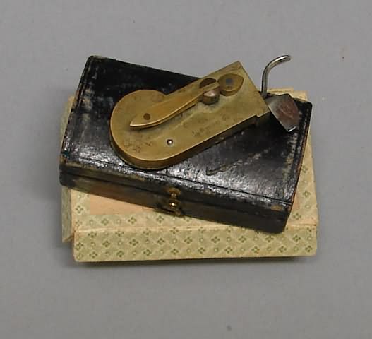 Appraisal: Cased spring loaded brass bleeder No markings Bleeder measures in