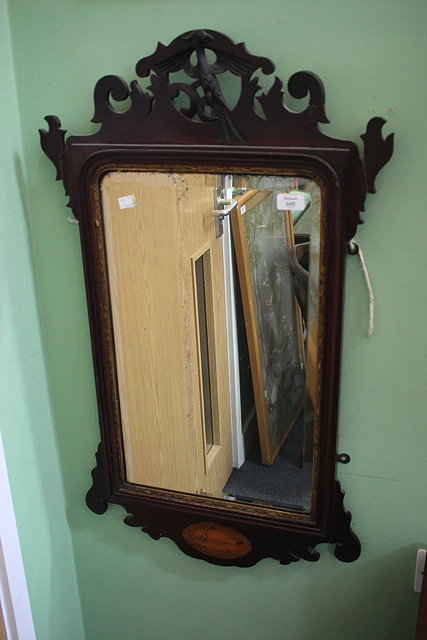 Appraisal: A GEORGIAN STYLE FRET FRAMED MAHOGANY WALL MIRROR with Hoho