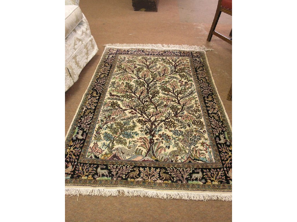 Appraisal: An Indian silk rug animals and numerous plants multi-coloured against