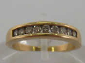 Appraisal: A carat yellow gold and diamond half hoop ring the