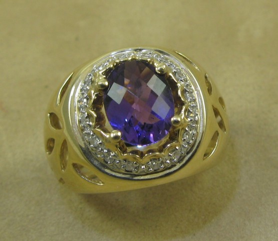 Appraisal: AMETHYST AND DIAMOND RING k yellow gold and centering an