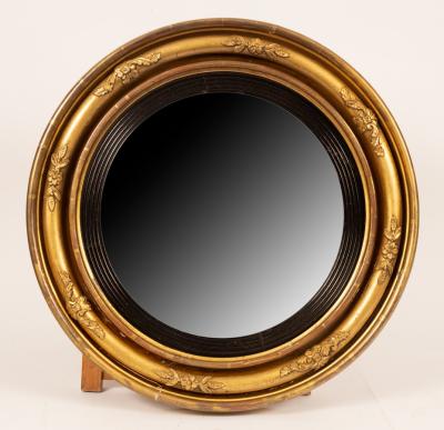 Appraisal: A th Century gilt framed convex mirror with a fluted