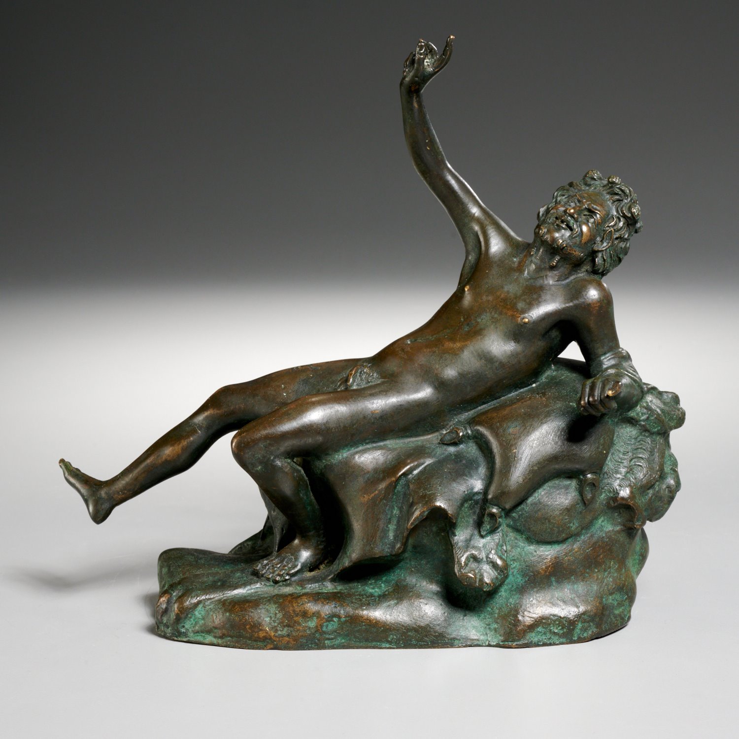 Appraisal: GRAND TOUR BRONZE OF RECLINING BACCHUS th c Italian dark