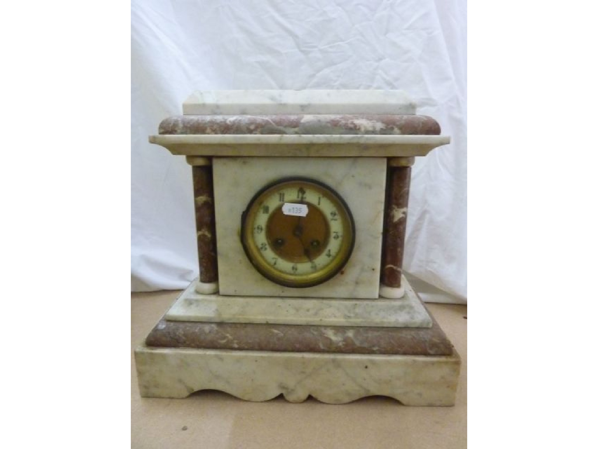 Appraisal: A Victorian white and coloured marble mantel clock with -day