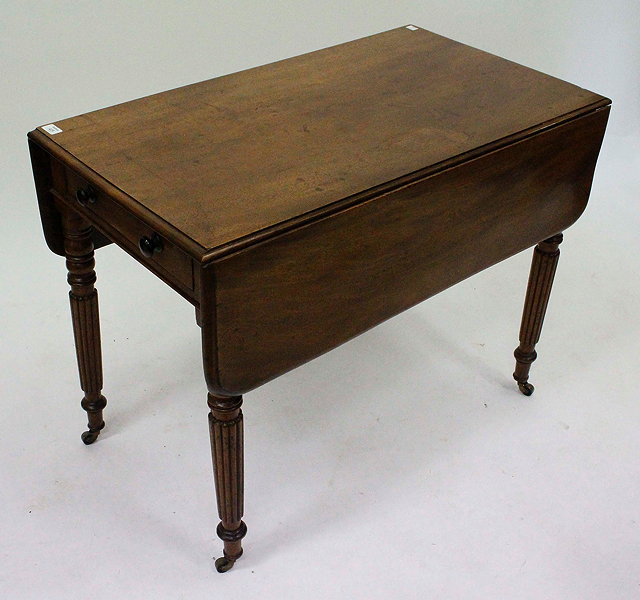 Appraisal: A VICTORIAN MAHOGANY PEMBROKE TABLE with reeded tapering legs and