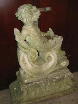 Appraisal: A COMPOSITION STONE ALLEGORICAL FIGURE Autumn modelled as a putto