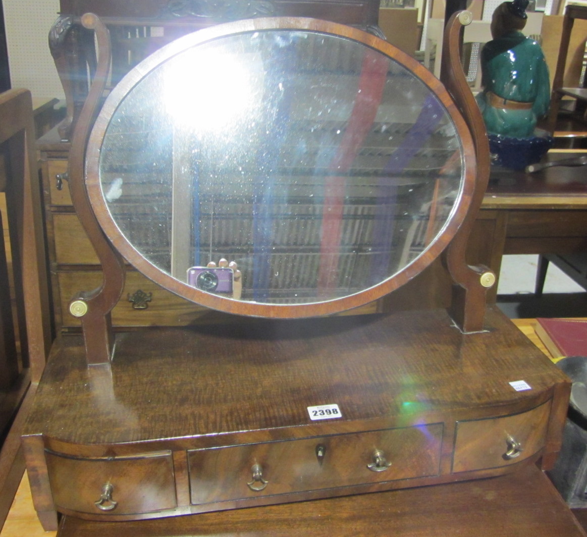 Appraisal: A mahogany swing frame dressing table mirror