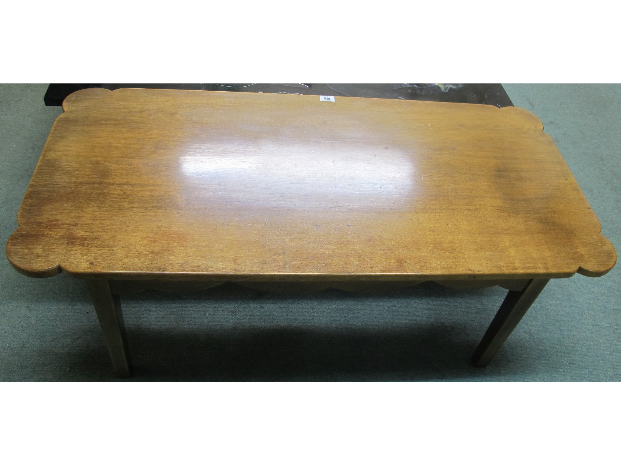 Appraisal: A scalloped edged th Century light oak coffee table