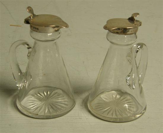 Appraisal: Pair of George V glass and silver mounted Whiskey noggins