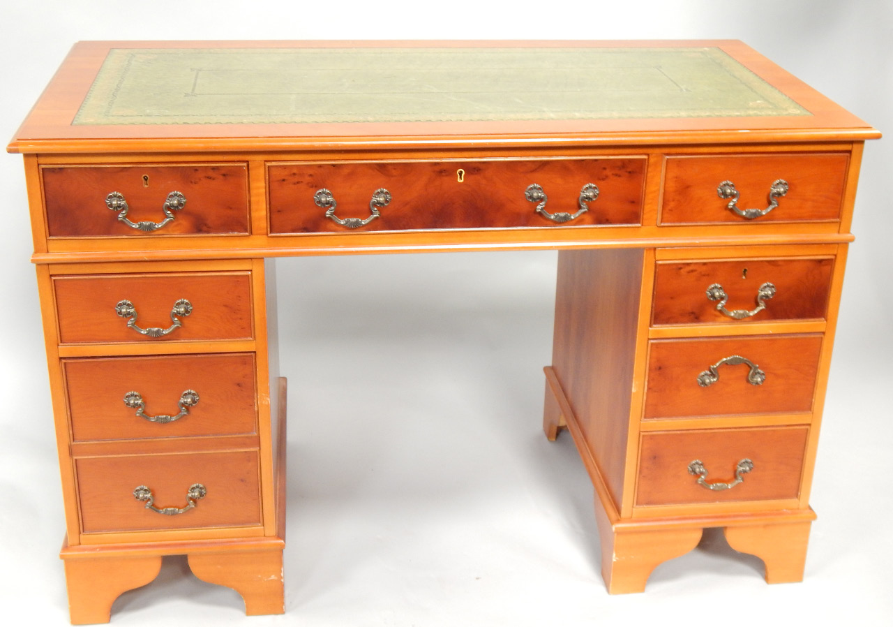 Appraisal: A Georgian style knee hole desk with inset leather top