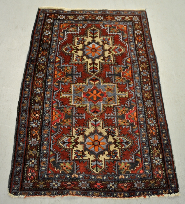 Appraisal: - Oriental hall mat with three geometric medallions on overall