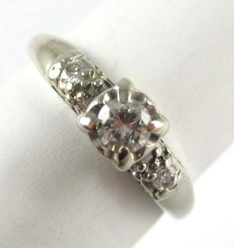 Appraisal: DIAMOND AND FOURTEEN KARAT GOLD RING The white gold ring