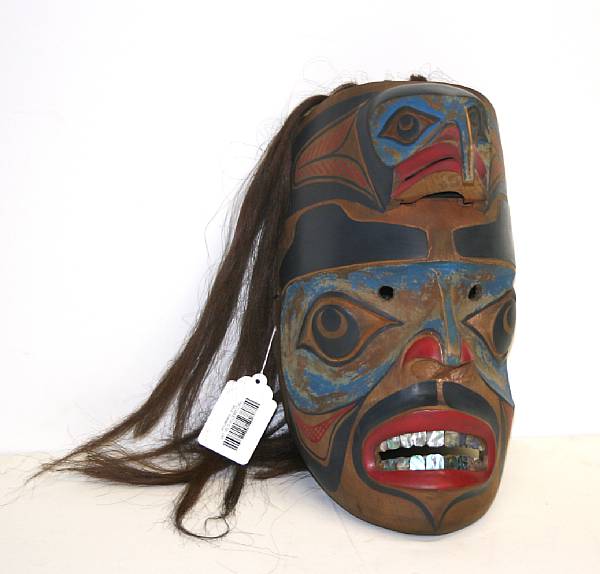 Appraisal: A Northwest Coast mask With articulated raptor head frontlet abalone