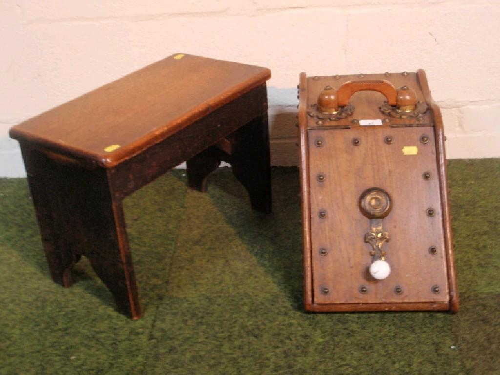 Appraisal: A late Victorian oak coal scuttle and an oak stool