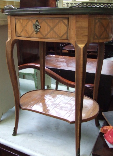 Appraisal: A th century French tulipwood and rosewood oval table en