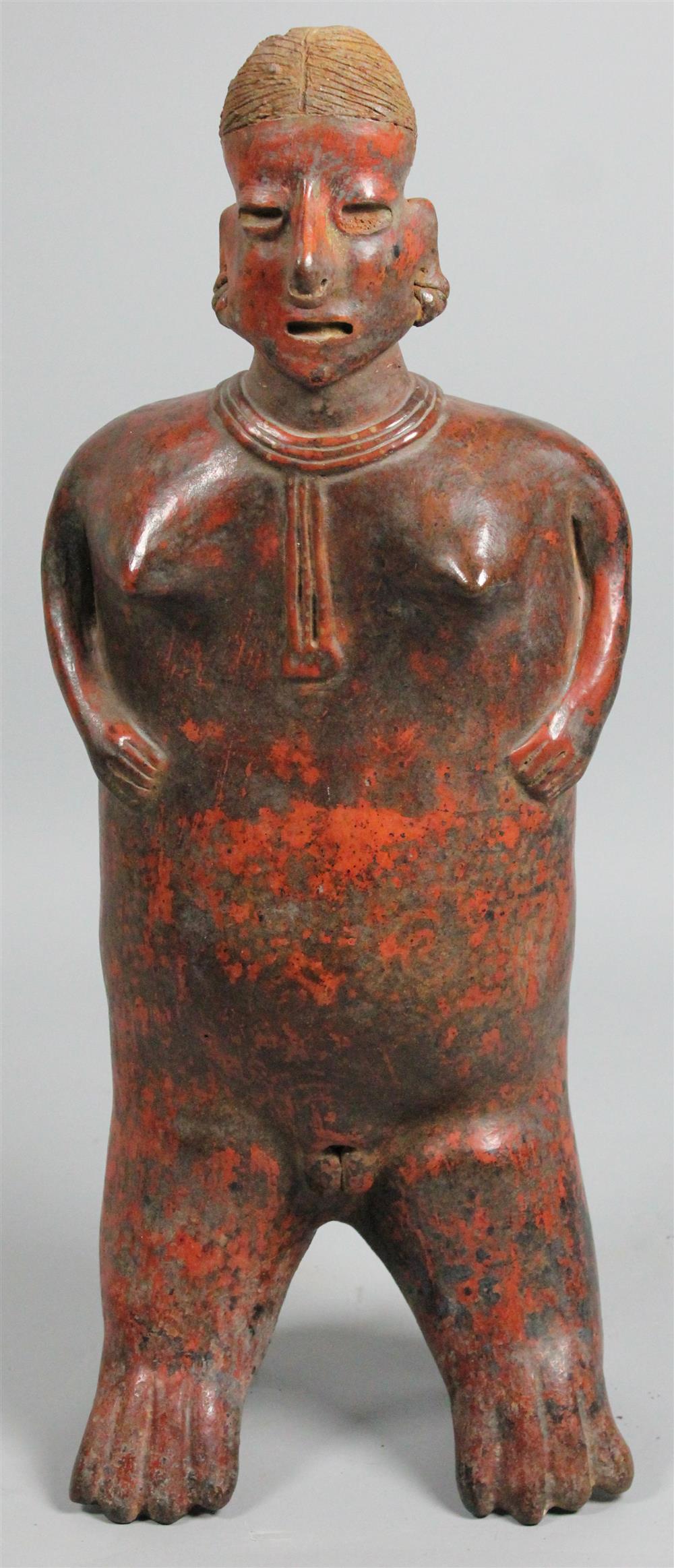 Appraisal: A PRE-COLOMBIAN-STYLE TERRACOTTA FIGURE OF A WOMAN traces of paint