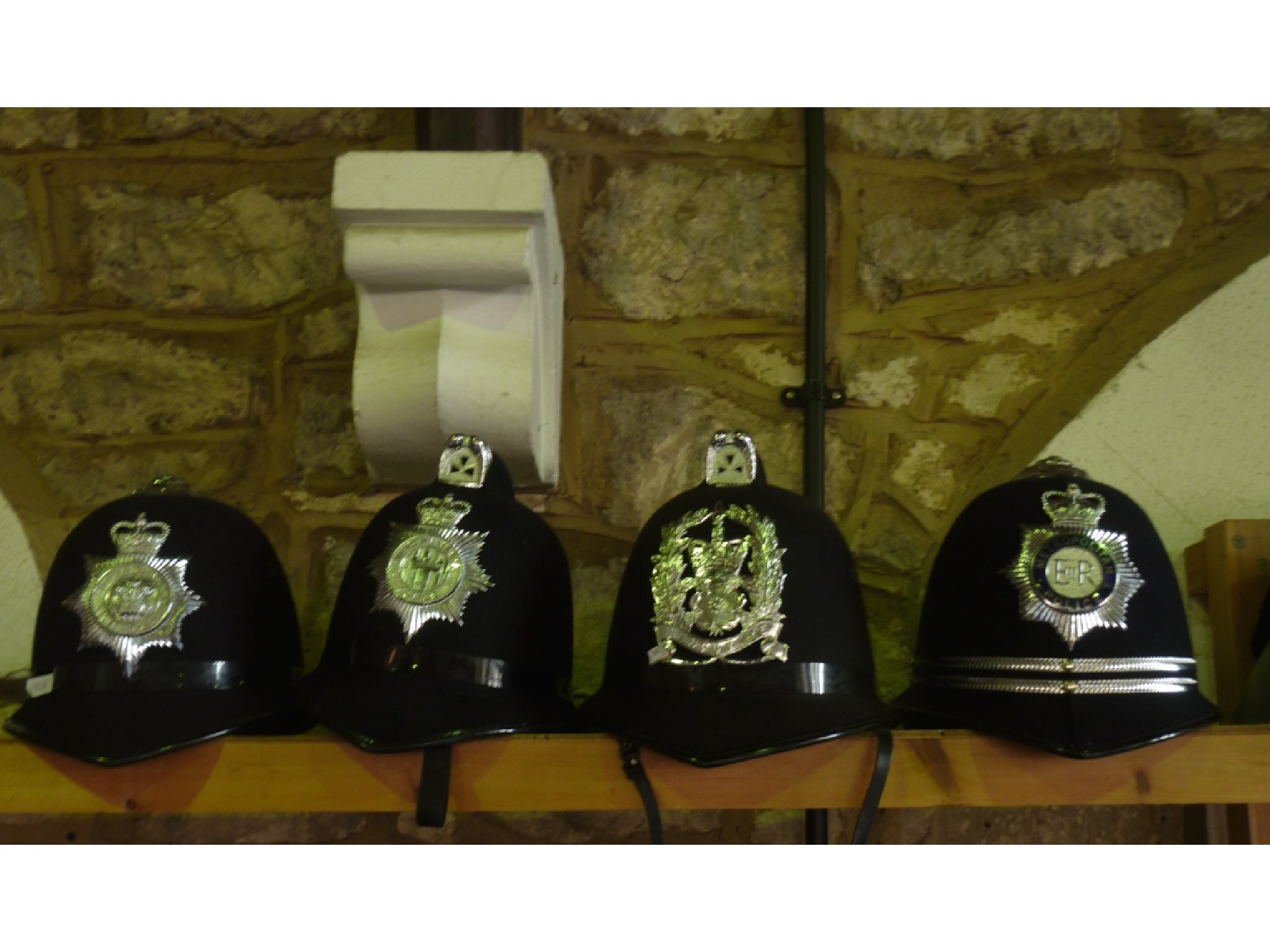 Appraisal: Four policeman's constabulary helmets Hampshire Northumbria South Wales and the