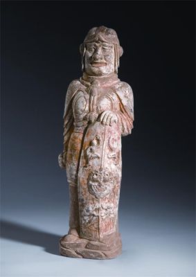 Appraisal: A Chinese pottery model of a soldier standing erect and