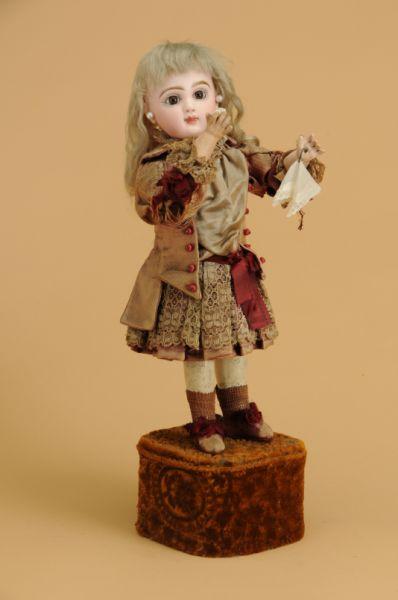 Appraisal: Lambert Automaton Child with Jumeau Head France ca bisque flange