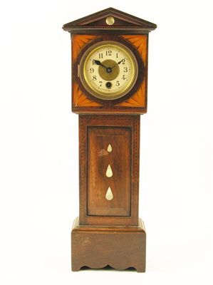 Appraisal: A rosewood and miniature longcase clock with a German movement