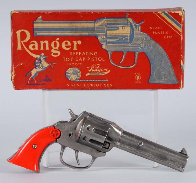 Appraisal: Ranger Cap Gun Description Orange grips Grips are warped at