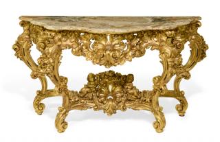 Appraisal: AN ITALIAN ROCOCO REVIVAL GILTWOOD SERPENTINE CONSOLE TABLE AN ITALIAN