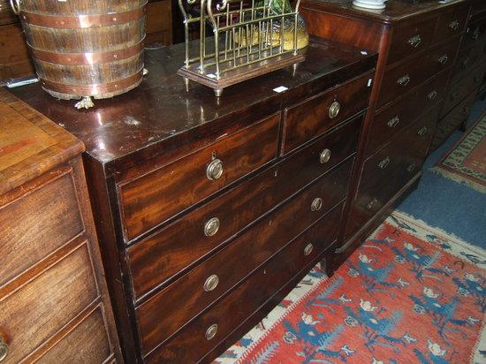 Appraisal: A late Georgian mahogany chest of two short and three