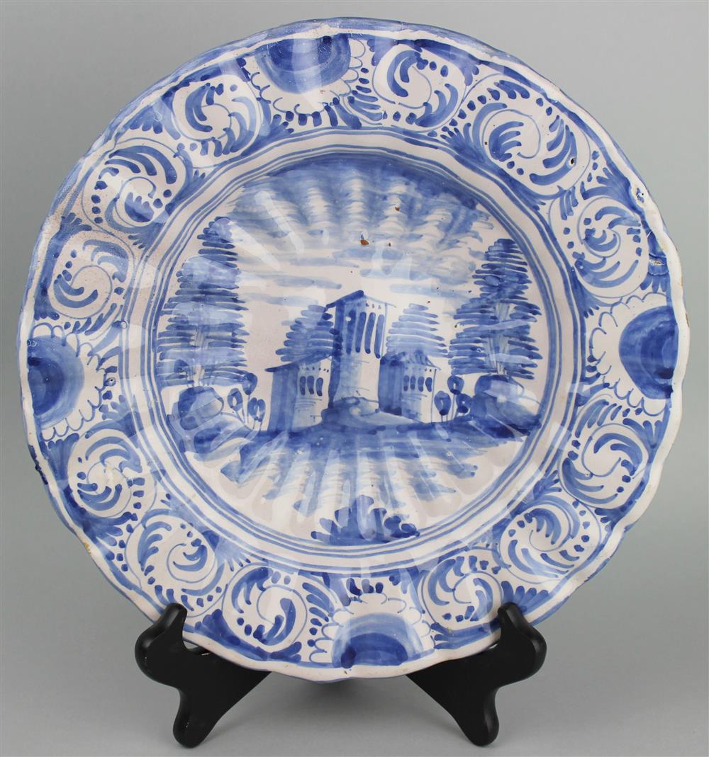 Appraisal: DELFT BOWL WITH FLUTED EDGES depicting a building surrounded by