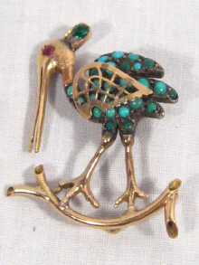 Appraisal: A high carat gold and turquoise set bird brooch