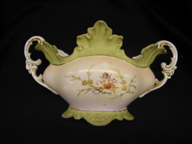 Appraisal: Imperial Carlsbad Austria Porcelain Planter cherub decor handled