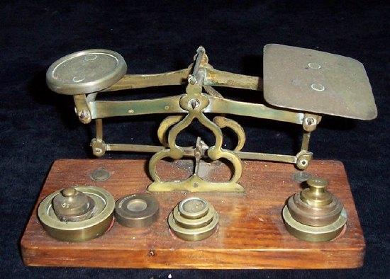 Appraisal: A set of letter scales and weights on an oak